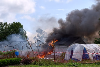 Enraged crowd sets Ebola hospital tent on fire in Democratic Republic of Congo