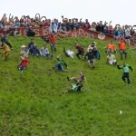 German YouTuber Tom Kopke defeats local rival in Cooper's Hill cheese rolling chaos