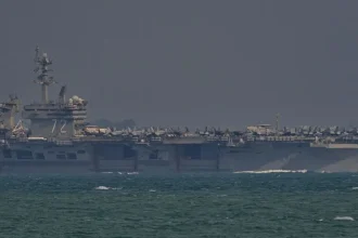 President Trump claims 'massive' US armada is on the way as tensions with Iran escalate