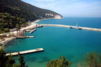 What is "Kushner Island" and why are Albanians protesting about it?