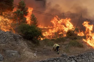 Wildfires in Catalonia close major roads and suspend train services, disrupting travel to Spain