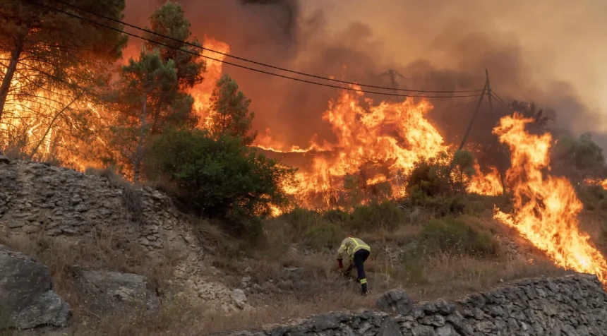 Wildfires in Catalonia close major roads and suspend train services, disrupting travel to Spain