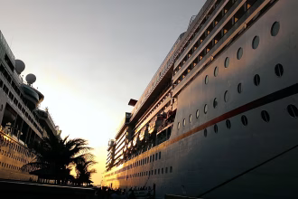 Cruises exacerbate overtourism and emit carbon, so why are they taxed less than hotels?
