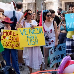 'Let's read America again': Venice protesters greet US ambassador with protest placards
