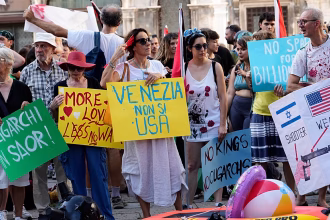 'Let's read America again': Venice protesters greet US ambassador with protest placards