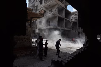 The Damascus explosion was caused by a bomb, and the death toll rose to five, state television reported.